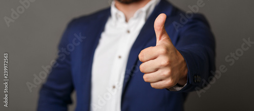 Unrecognizable businessman showing thumb up gesture panorama photo