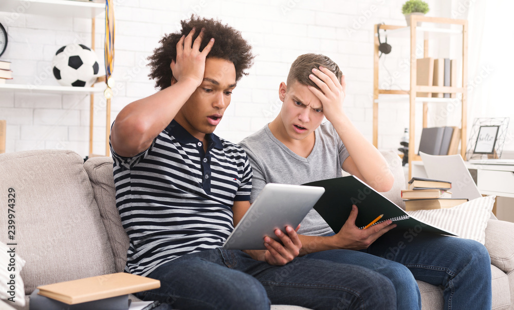 Shocked students preparing for exams at home Shocked students preparing for exams at home