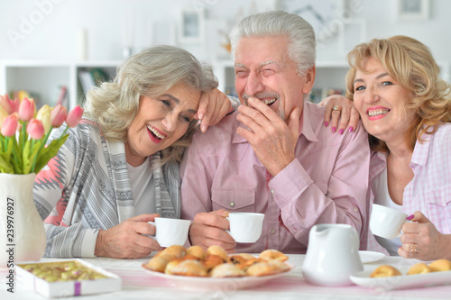 Close up portrait of senior people drinking tea