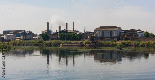 Landscape view of large factory on river nile in Egypt