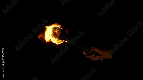 Burning Torch Is Held Up Then Goes Off photo