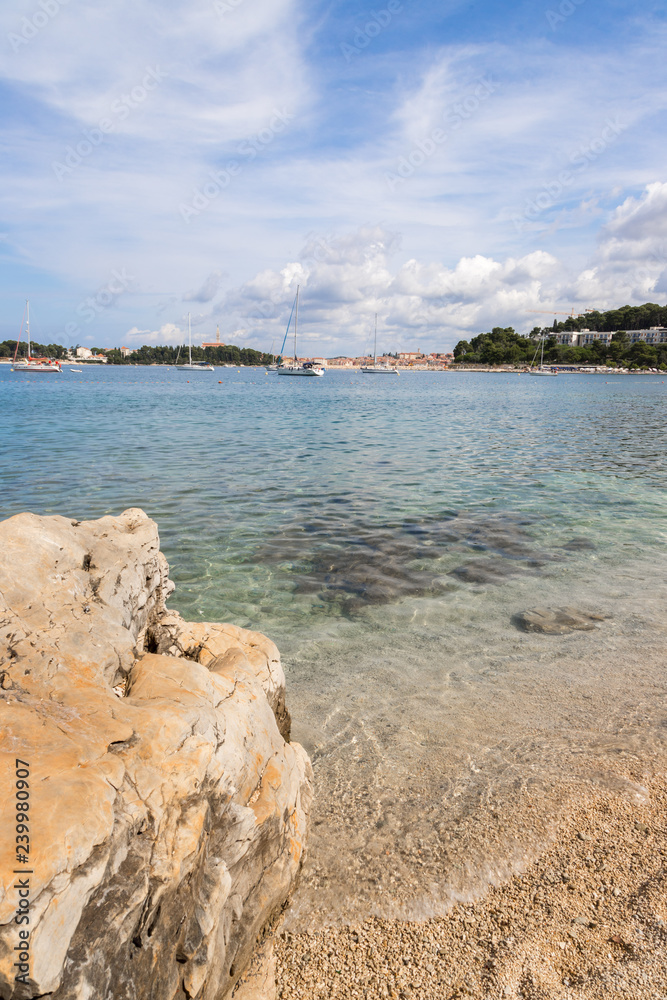 Gravel beach with rocks on the croatian Coast, clear water