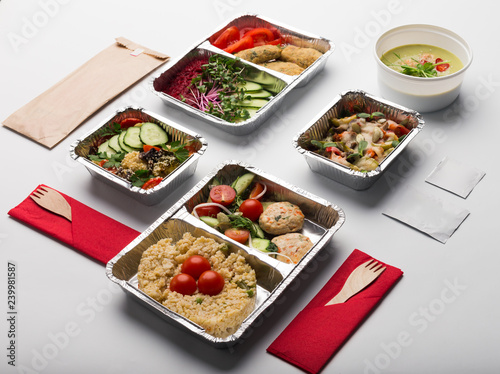 Take away meals in aluminium boxes with cutlery