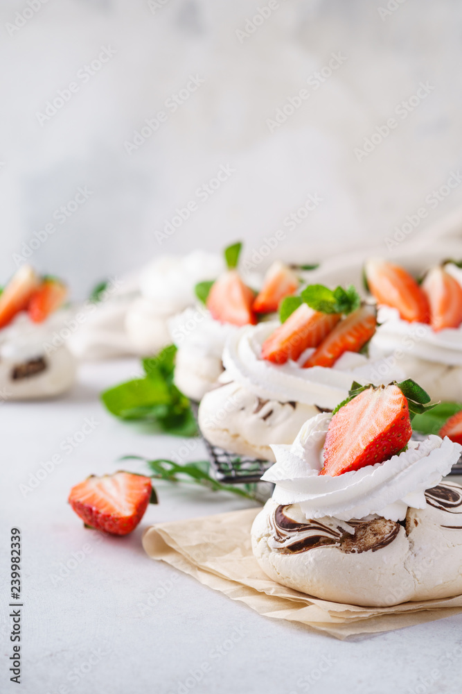 Pavlova cakes with whipped cream and fresh summer berries. Pavlova cakes with whipped cream and fresh summer berries.