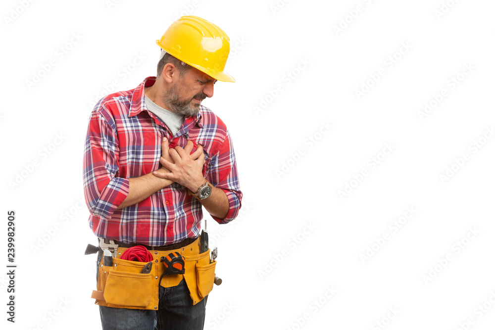 Builder touching chest as heart attack gesture.