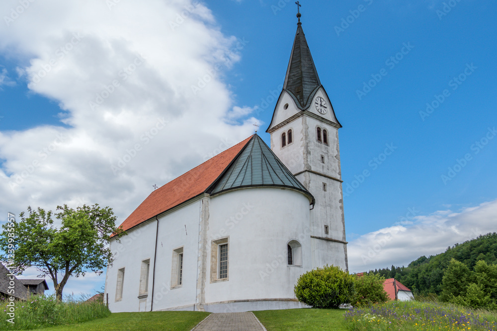 Old vintage small cristian church with one bell tower.