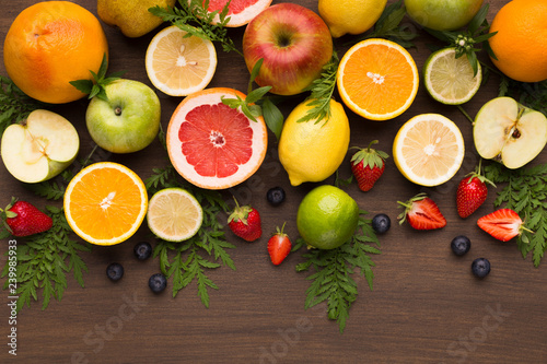 Summer fruit and berries assortment on wooden background