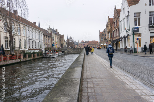 Bruges, Belgium on November 25, 2018: Medieval architecture and channels  in  Bruges the largest city of the province of West Flanders in the Flemish Region of Belgium. photo