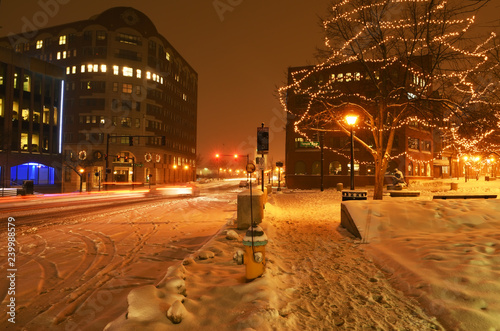 The streets of the night winter city during a snowfall. Portland. USA. Maine. 