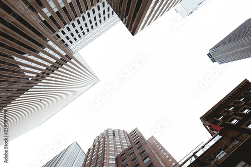 bottom view of skyscrapers and clear sky in new york city, usa