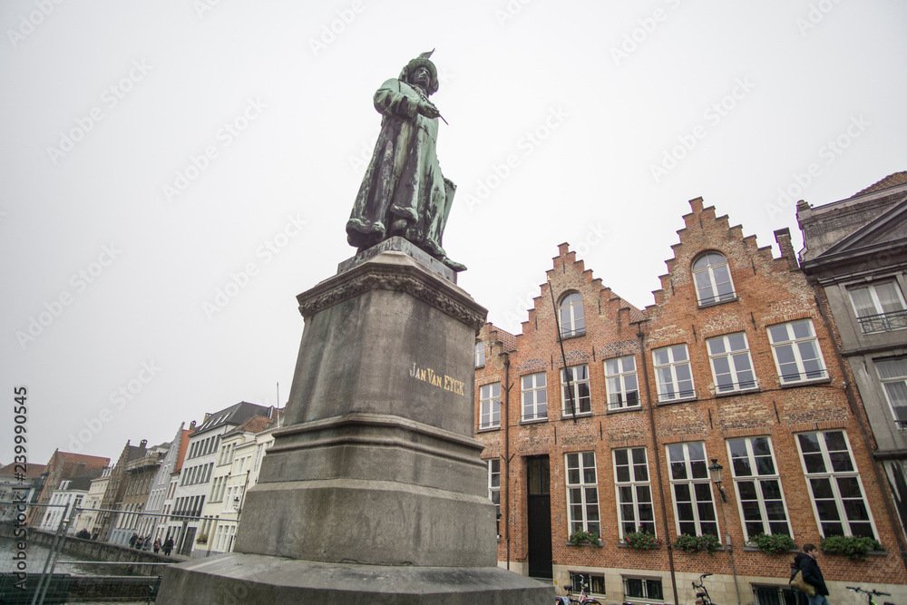 Jan Van Eyck memorial and Typical belgian architecture in Bruges - old town - Belgium