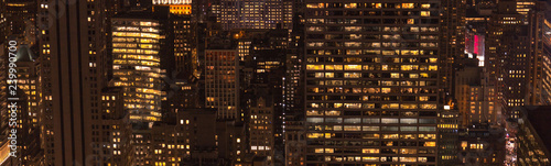 panoramic view of buildings and night city lights in new york, usa