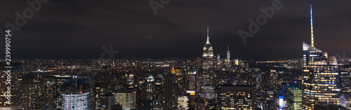 panoramic view of buildings and night city lights in new york, usa