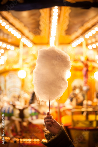Canvas Print A cotton candy in front of an ancient German Horse Carousel built in 1896 in Nav