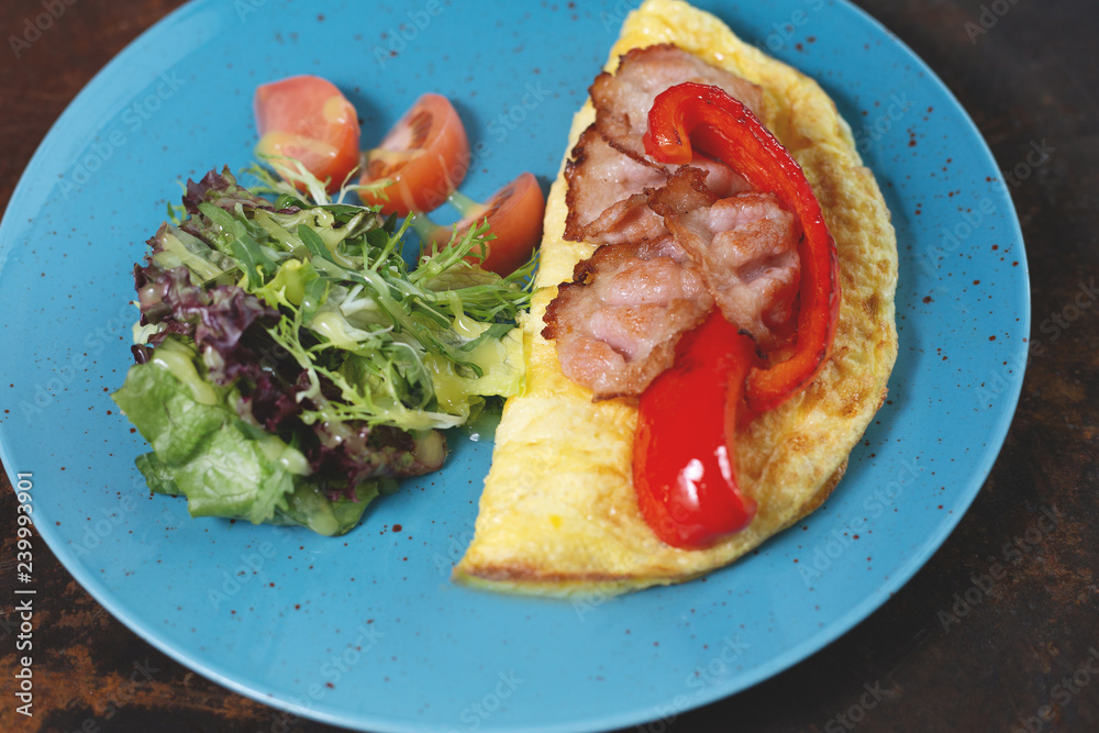 Delicious breakfast. Fried omlette with sliced ham Delicious breakfast. Fried omlette with sliced ham