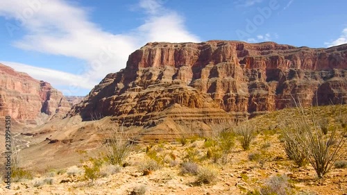 landscape and nature concept - aerial view of grand canyon cliffs and arid river bed from helicopter