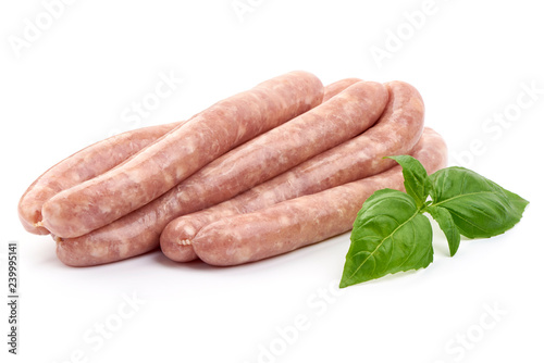 Delicious Raw Sausages for barbecue with basil leaf, close-up, isolated on white background