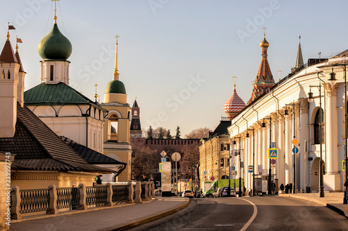 Moscow downtown. View of old historical architecture  Varvarka Street, churches,  Kremlin wall  and the dome of St. Basil's Cathedral in autumn photo