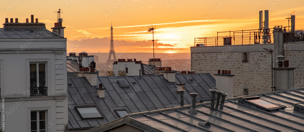 The Eiffel Tower and the rooftops of Paris seen from Montmartre with a sunset - obrazy, fototapety, plakaty 
