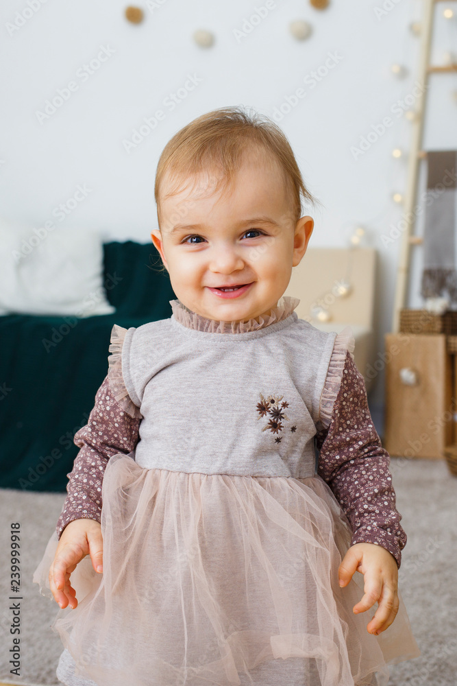 Image of sweet and cute baby girl in dress, portrait of beautiful 1 year  old smiling girl, toddler. Happy child Stock Photo | Adobe Stock
