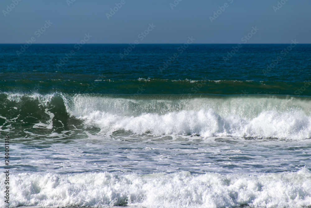 Atlantic Ocean waves breaking on the sea shore