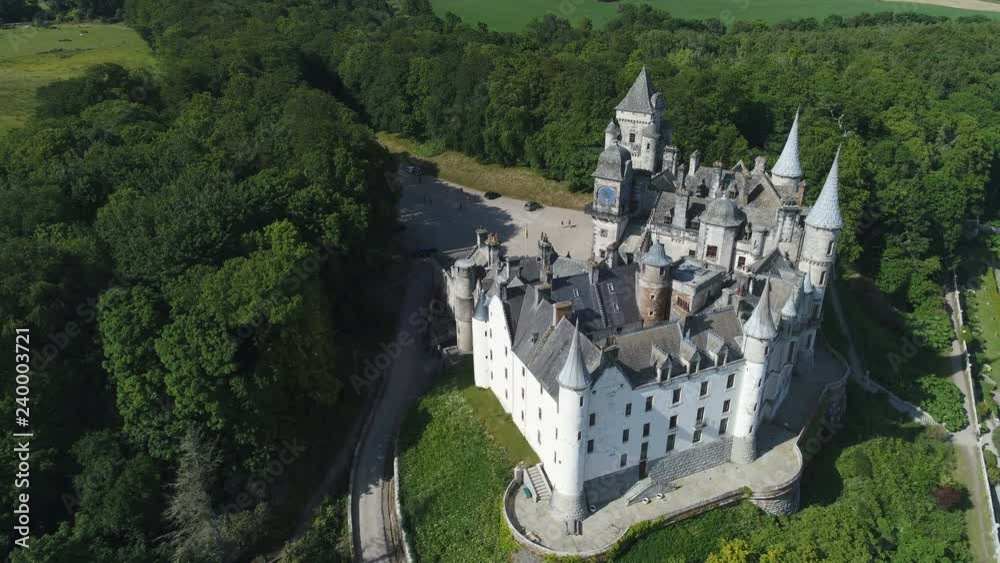 Tilting aerial view of spectacular Dunrobin castle, a popular tourist ...