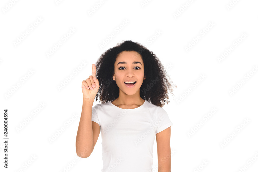 attractive african american girl in t-shirt showing idea gesture isolated on white attractive african american girl in t-shirt showing idea gesture isolated on white