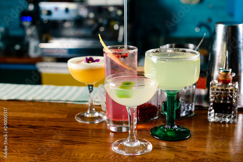 set of Classic alcoholic cocktails on bar counter in pup or restaurant with copy space