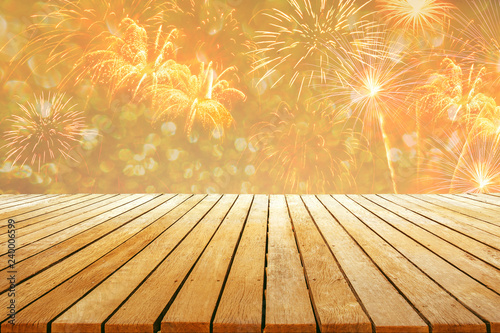 fireworks background with wooden table top for celebration design to gold color style