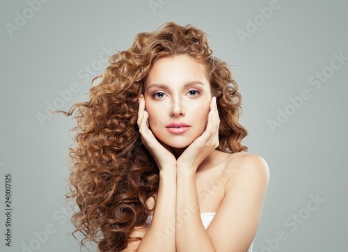 Gorgeous woman with perfect hair. Haircare, skin care and facial treatment concept