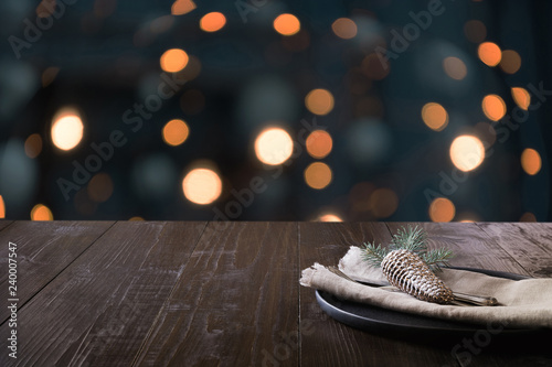 Christmas table setting and blurred kitchen as bachground. Space for montage your christmas products.