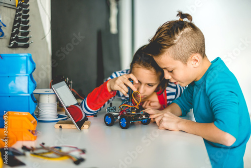Brother and sister working on school project