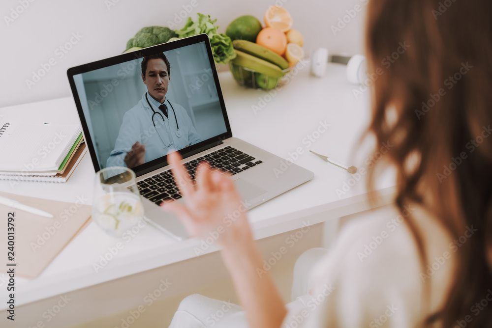 Lady making video call to her personal family doctor Lady making video call to her personal family doctor