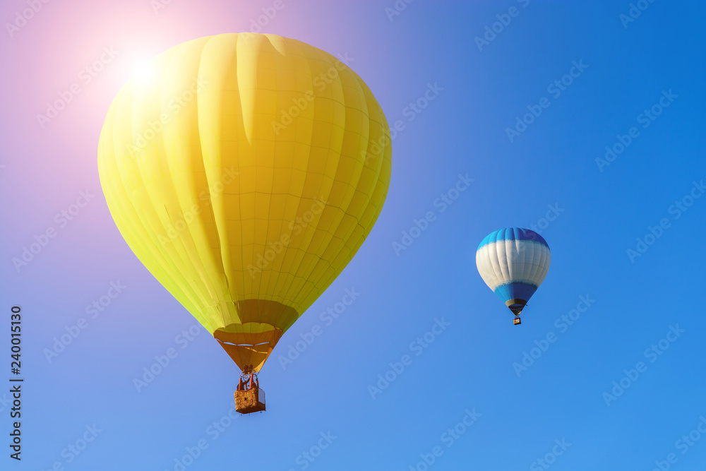 two hot air balloons in the blue sky two hot air balloons in the blue sky