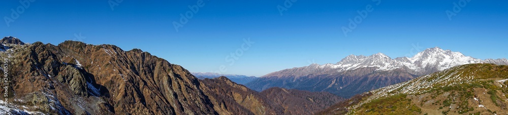 Beautiful view of mountain range from the peak of Achisho mountain, winter in Sochi, Russia.