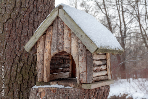 home nesting box made of wood in a winter park