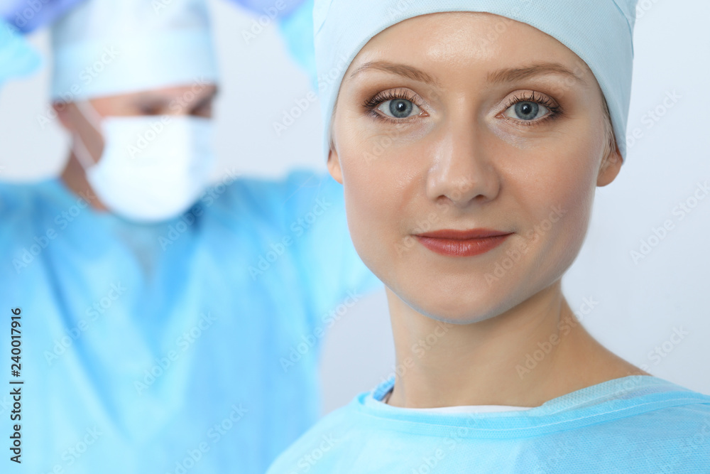 Boss surgeon is examining the operation while medical team are busy of patient. Medicine, healthcare and emergency in hospital Boss surgeon is examining the operation while medical team are busy of patient. Medicine, healthcare and emergency in hospital