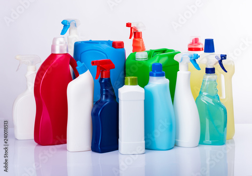 Fotografie Cleaning concept with various plastic bottles and canisters on white background