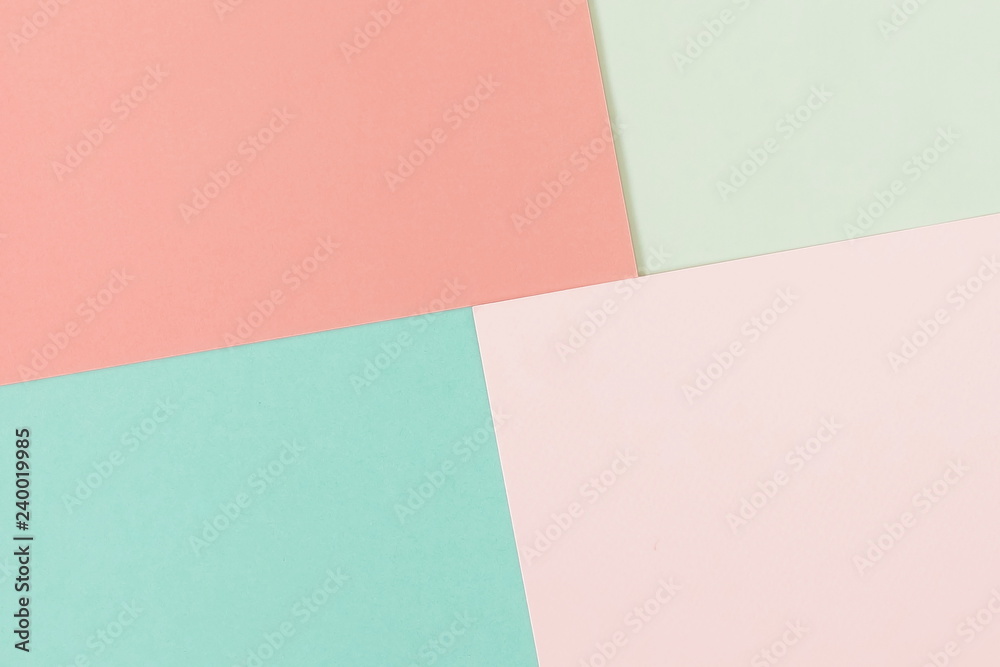 Abstract geometric paper background in pastel colors. fashion trend colors living coral and mint. Minimal concept. Flat lay, Top view. Copy space Abstract geometric paper background in pastel colors. fashion trend colors living coral and mint. Minimal concept. Flat lay, Top view. Copy space