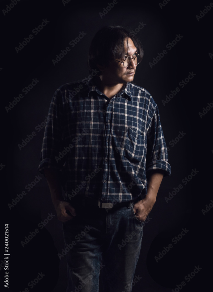 Middle aged man On a black background The concept of working people. Middle aged man On a black background The concept of working people.