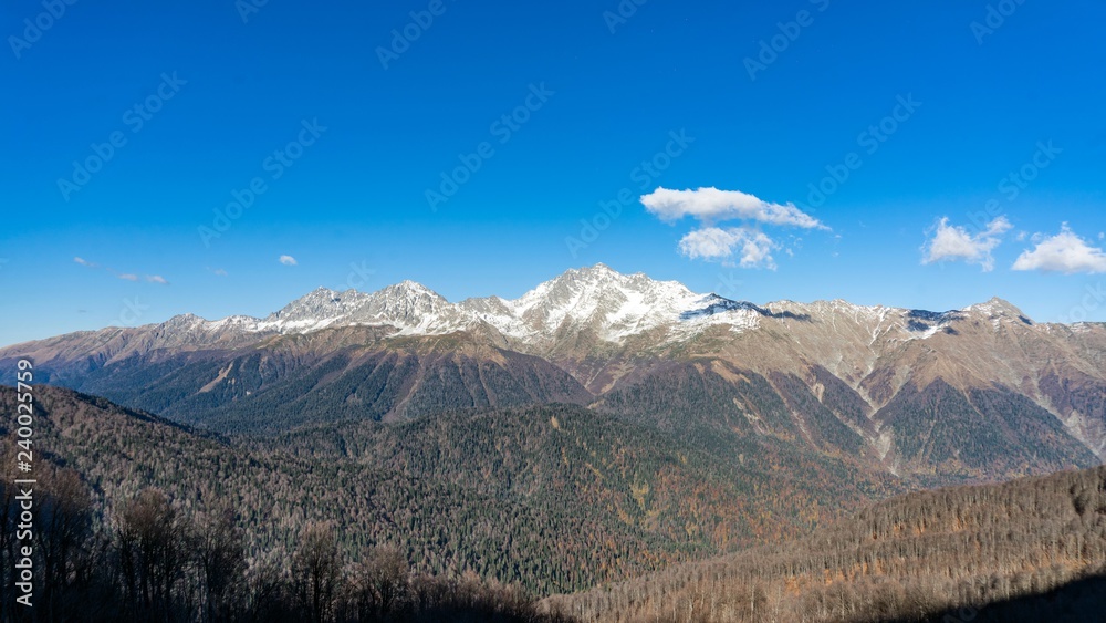 Beautiful view of mountain range from the peak of Achisho mountain, winter in Sochi, Russia.