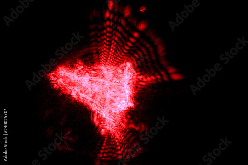 Red abstract background. Splash. Play with light. Abstraction. Cosmos. Wallpaper