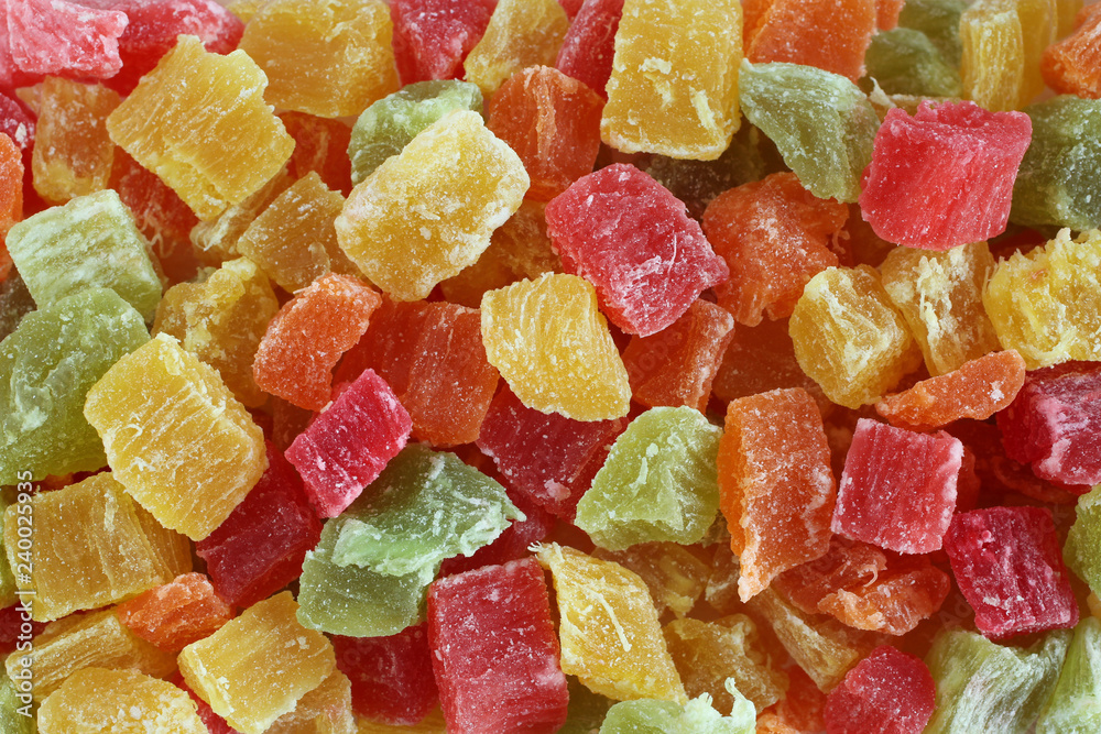 Food background - sweet candied fruit bits situated arbitrarily Food background - sweet candied fruit bits situated arbitrarily
