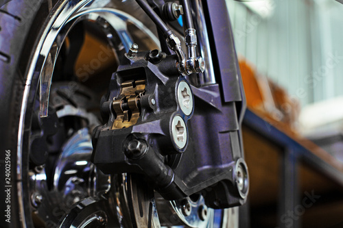 Cropped close up shot of beautiful and custom made motorcycle in the workshop