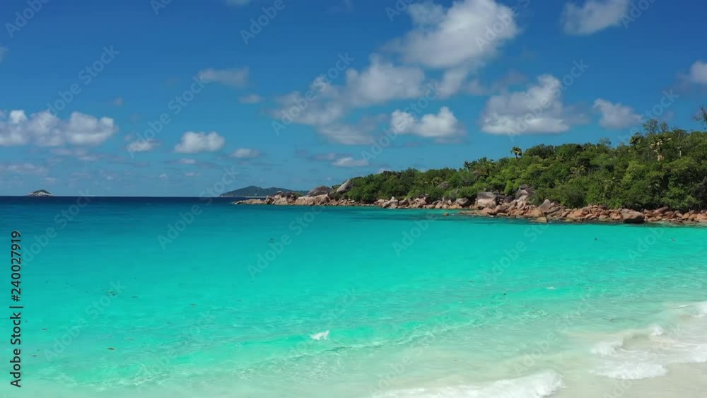 Aerial view of tropical paradise beach with white sand and turquoise crystal clear water of Indian Ocean - Anse Lazio, Praslin Island, Seychelles Aerial view of tropical paradise beach with white sand and turquoise crystal clear water of Indian Ocean - Anse Lazio, Praslin Island, Seychelles