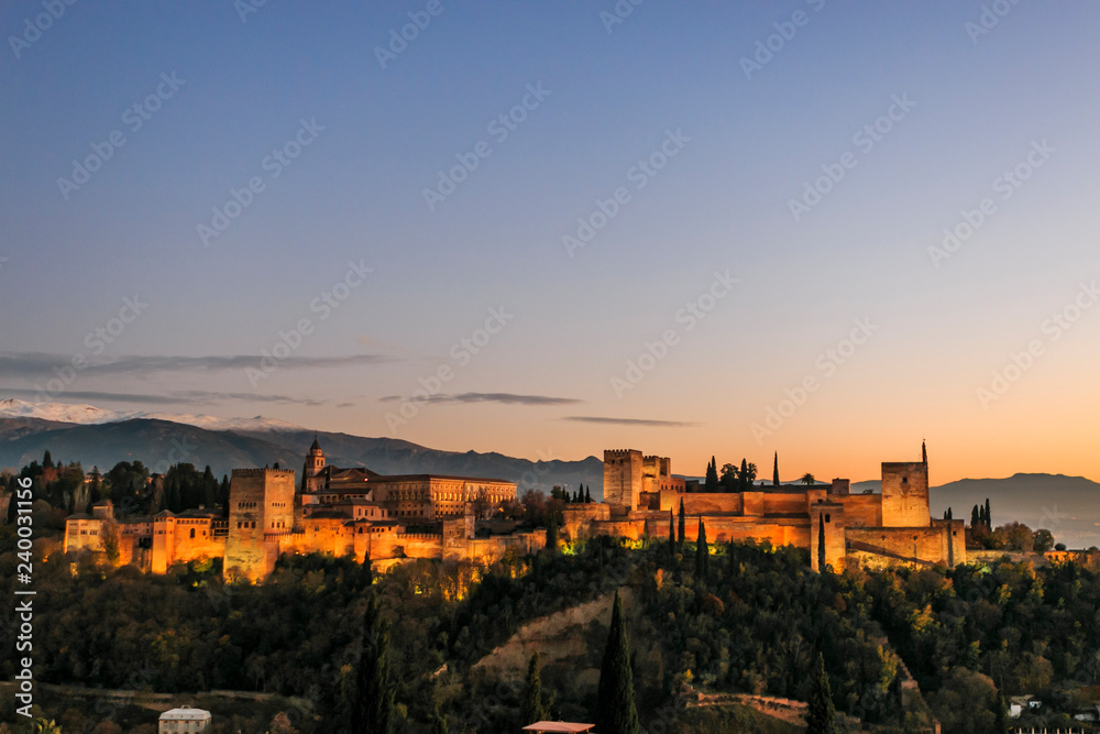Granada España. Panoramic view of Alhambra palace and fortress with Sierra Nevada at the background. Travel destination in Spain