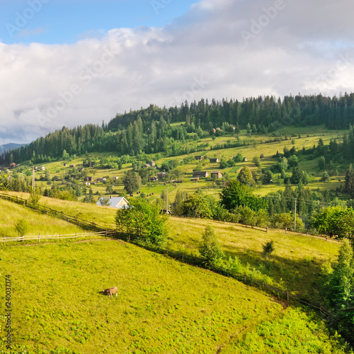 Slopes of mountains and clouds in the evening sky. Location place Carpathian  Ukraine  Europe. Concept ecology protection. Explore the world s beauty.
