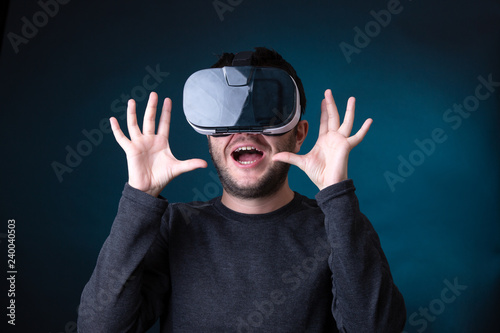 Image of surprised man in virtual reality glasses