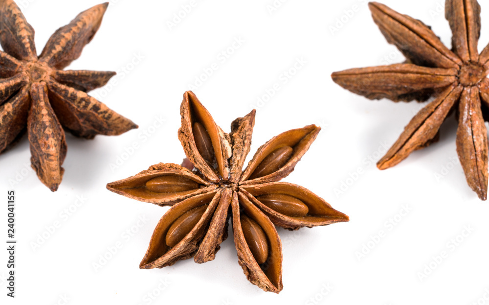 Three dry star anise fruits isolated on white Three dry star anise fruits isolated on white