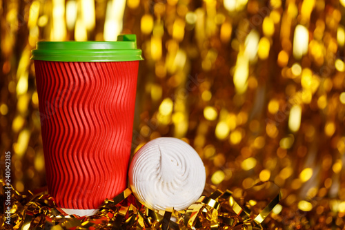 Coffee in red cup with marshmallow and Christmas golden metafan photo